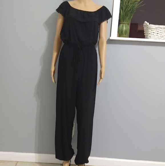 Black off the shoulder jumpsuit romper. - Picture 1 of 4